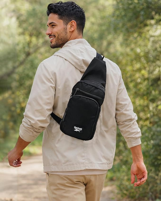 Reebok Unisex Crossbody Sling Bags – Compact Convertible Strap Cross Body Bag Travel Sling Bag - Gym & Travel Essential, Cosmos Black With White Logo