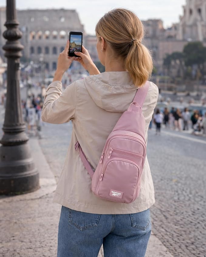 Reebok Unisex Crossbody Sling Bags – Compact Convertible Strap Cross Body Bag Travel Sling Bag - Gym & Travel Essential, Cosmos Infused Lilac